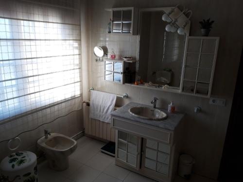 a bathroom with a sink and a toilet at Berdullas in Vilagarcia de Arousa