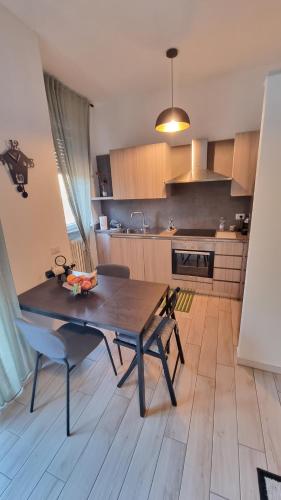a kitchen with a table and chairs in a room at Casachris in Meda