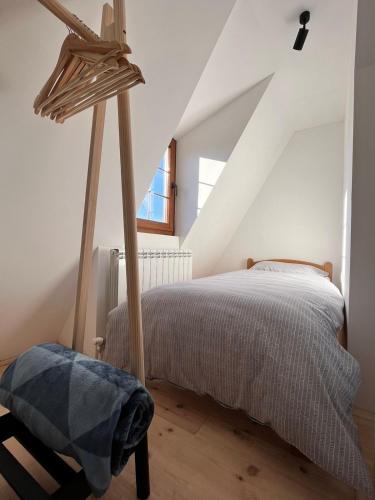 a bedroom with a bed in a attic at Villa Luce in Kolašin