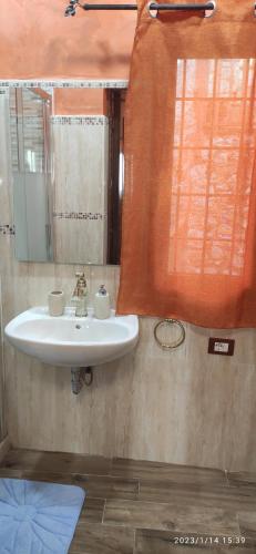 a bathroom with a sink and a mirror at CASA ALICE in Poggio Catino