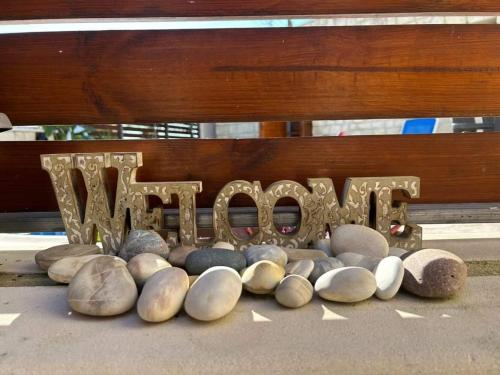 a bunch of rocks and a sign that saysilion at Fontana Traditional House in Anarita