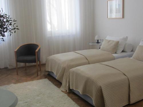 Postel nebo postele na pokoji v ubytování Hotel Wiener Kindl
