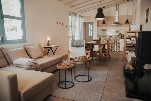 a living room with a couch and a table at Granja San Miguel in Salem