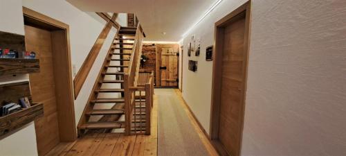 a hallway with a spiral staircase in a house at Unterlettlhof in Saalfelden am Steinernen Meer