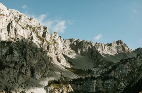 a large rocky mountain with a blue sky at Vila Verusa 2 in Podgorica