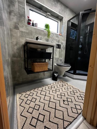 a bathroom with a sink and a toilet at Lazy Deer - Camp in Staniszów