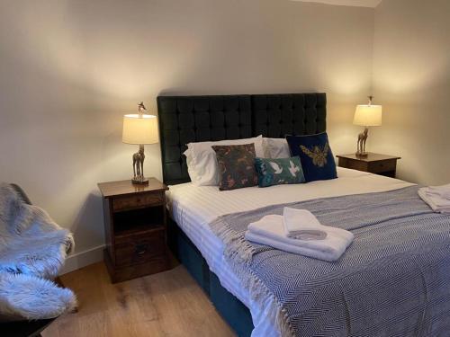 a bedroom with a large bed with two night stands at Charming BRIGHTONMEWS cottage parking 1min to sea&shops in Brighton & Hove