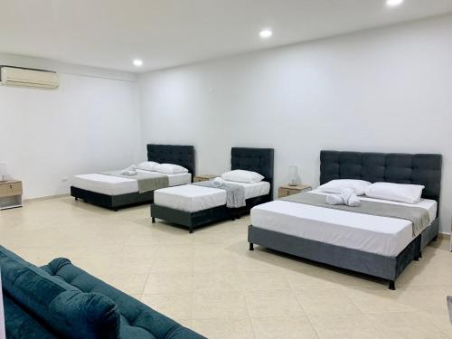 Postel nebo postele na pokoji v ubytování Hotel Santorini