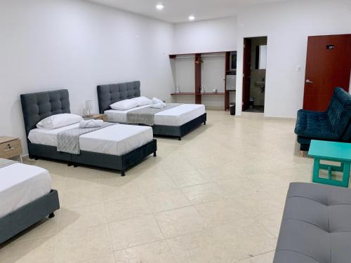 Postel nebo postele na pokoji v ubytování Hotel Santorini