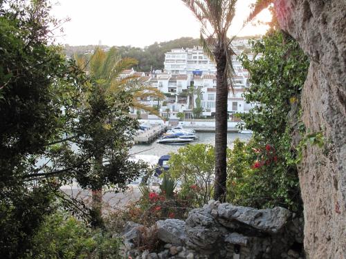 a view of a harbor with a boat in the water at Pensión La Herradura in La Herradura