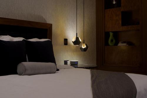 Ένα ή περισσότερα κρεβάτια σε δωμάτιο στο Nueve 25 Hotel Boutique