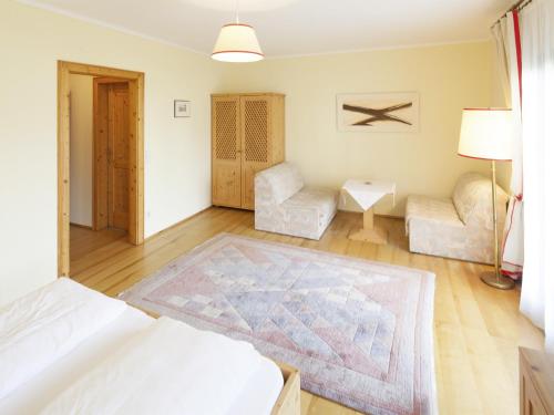 a living room with a bed and a couch at Gasthof Zur Traube in Grein