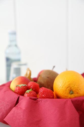 a bowl of fruit on a pink cloth at Stadt-gut-Hotel Rheinischer Hof in Essen