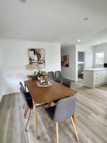 a dining room with a wooden table and chairs at Pet friendly, Family home close to town in Cowes