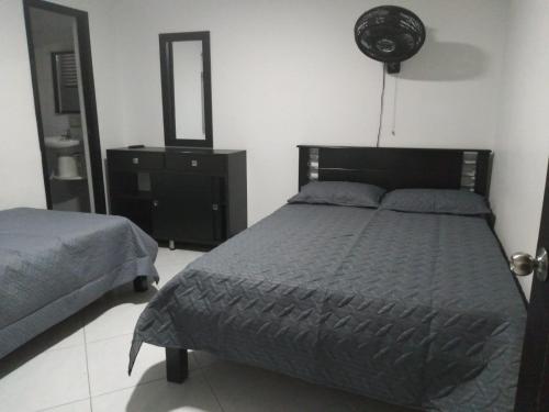 Ένα ή περισσότερα κρεβάτια σε δωμάτιο στο Hotel Murano Medellín