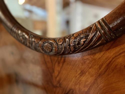 a close up of a wooden table with a mirror at La Alberguería complejo rural in Cañamero