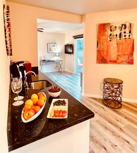 a kitchen with a bowl of fruit on a counter at West Sonoma Inn & Spa in Guerneville