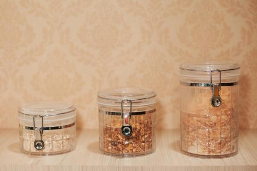 three jars of food items sitting on a table at Rigo Hotel in Santa Rosa