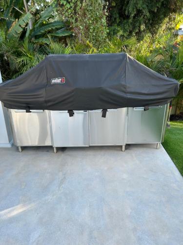 a table with a black cover on top of it at Men only clothing option guesthouse near Wilton Manors in Fort Lauderdale