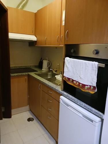 a kitchen with a dish towel hanging on the oven at Apartment Lissabon Estrela in Lisbon