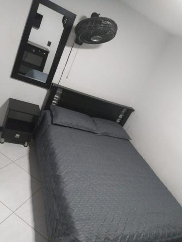 Ένα ή περισσότερα κρεβάτια σε δωμάτιο στο Hotel Murano Medellín
