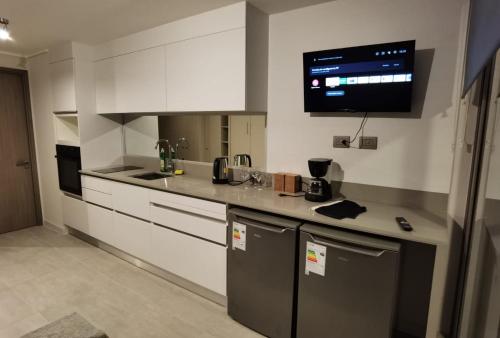 Η κουζίνα ή μικρή κουζίνα στο Exquisito Departamento Reñaca en el sector más turístico