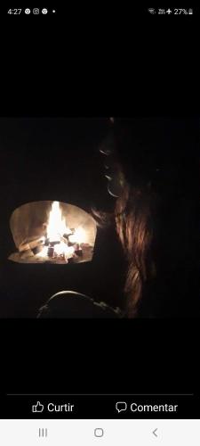 a picture of a fire in a oven at Pousada Vale Monte Azul in Santo Antônio do Pinhal