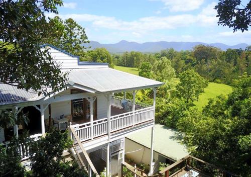 an aerial view of a white house with a porch at Bellingen Belfry Guesthouse in Bellingen