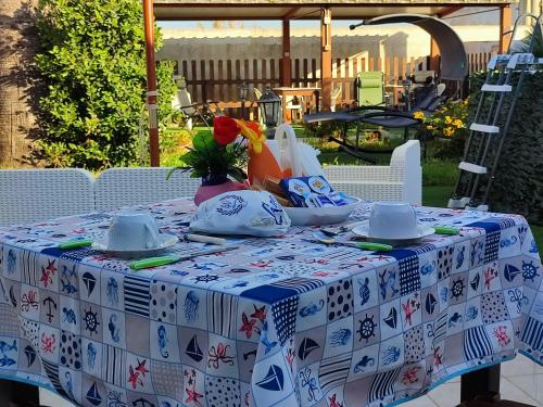 a table with a blue and white table cloth at Le Due Palme in Marsala