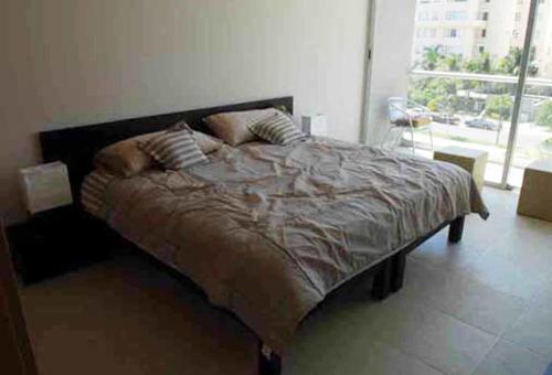 A bed or beds in a room at Apartamento Acapulco Diamante - Condominium Aura