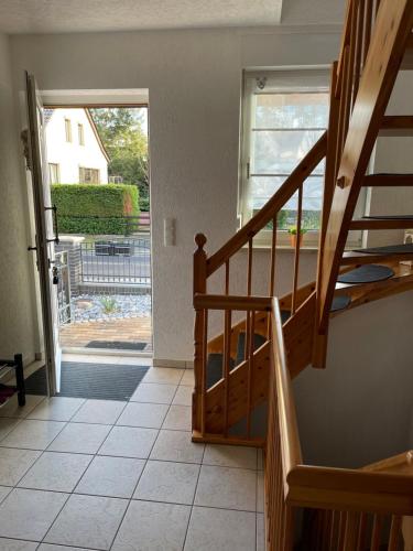 a staircase in a house with a sliding glass door at Oase der Ruhe 2 in Waldsieversdorf