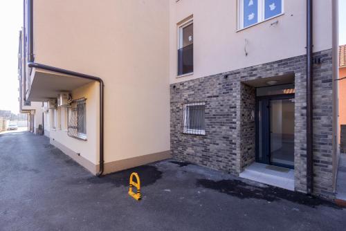 a building with a door open on a street at Altina Connect - all new, parking, Netflix in Belgrade