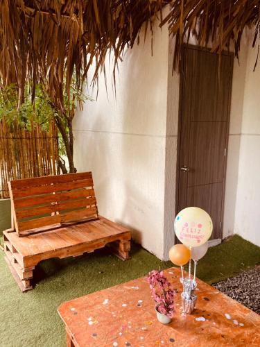 a bench and a table with a balloon on it at VILLA CRISTAL in Santa Helena