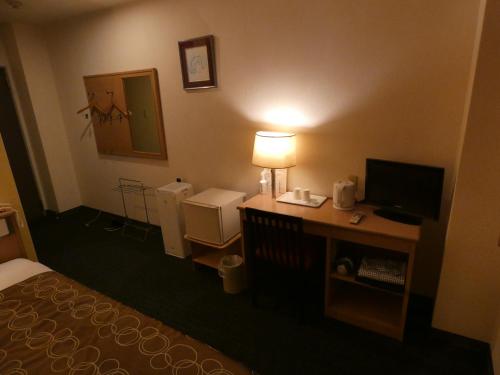 Postel nebo postele na pokoji v ubytování Hotel Tsuchiya