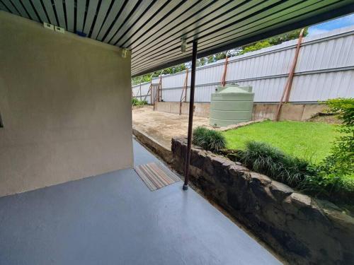 an outside view of a building with a patio at Spacious 4-bdrm fully self-contained WIFI, Parking in Suva