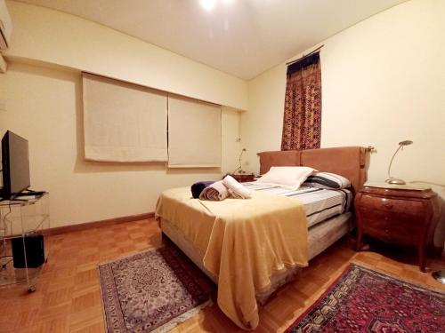 Voodi või voodid majutusasutuse Elegante alojamiento en pleno Recoleta toas