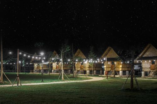 a playground at night with lights in a field at INAGRO in Bogor
