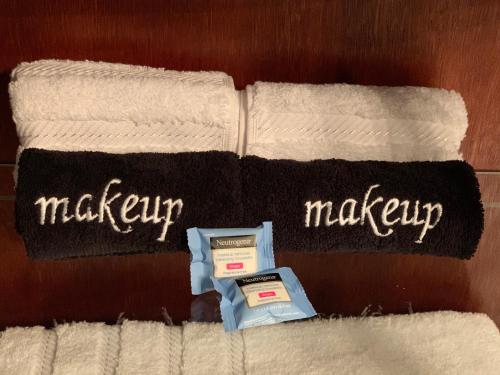 a pair of towels with the word makeup on them at Pope House - Hist. Mansion - The Gold Rush Suite in Helena