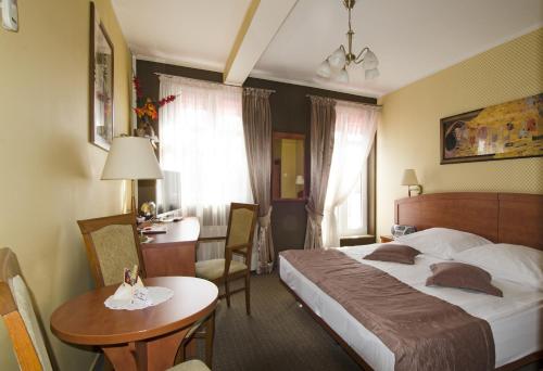 Postel nebo postele na pokoji v ubytování Hotel Atrium