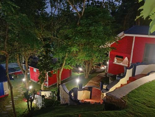 an aerial view of a house at night with lights at VIP GARDEN RESORT in Varkala