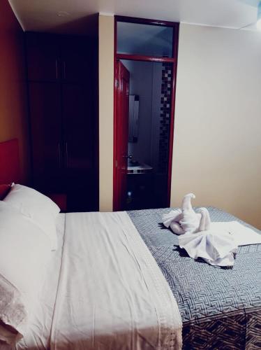 Ένα ή περισσότερα κρεβάτια σε δωμάτιο στο Hostal Casa de Ana