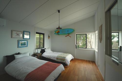 Llit o llits en una habitació de STRADDIE HOUSE tateyama