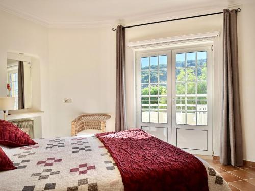Ένα ή περισσότερα κρεβάτια σε δωμάτιο στο Casa da Aldeia