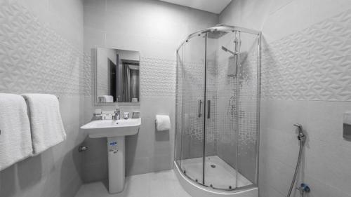 a bathroom with a shower and a sink at Mabaat - Alsalama - 513 in Jeddah