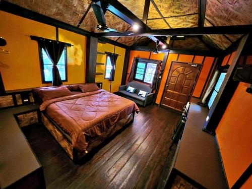 an overhead view of a bedroom with a bed at Flower Power Farm Village in Ko Phayam