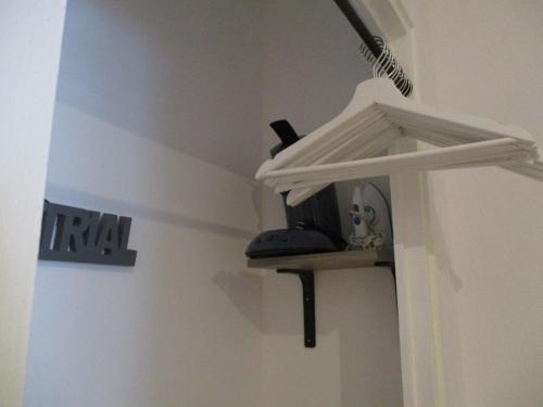 a room with a shelf on the side of a wall at Gîte les Bois in Orcival