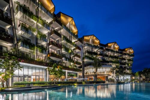 an exterior view of a building with a pool at Bellerive Hoi An Resort and Spa in Hoi An
