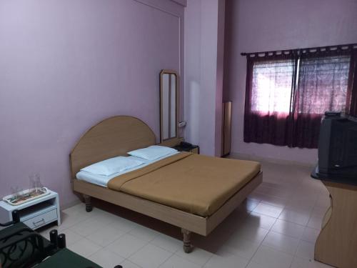 Кровать или кровати в номере Hotel Yatrik