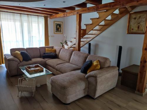 a living room with a couch and a table at Apartment in Lopar with sea view, terrace, air conditioning, washing machine 593-3 in Lopar