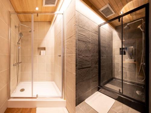 a shower with a glass door in a bathroom at MT. FUJI SATOYAMA VACATION in Fujinomiya